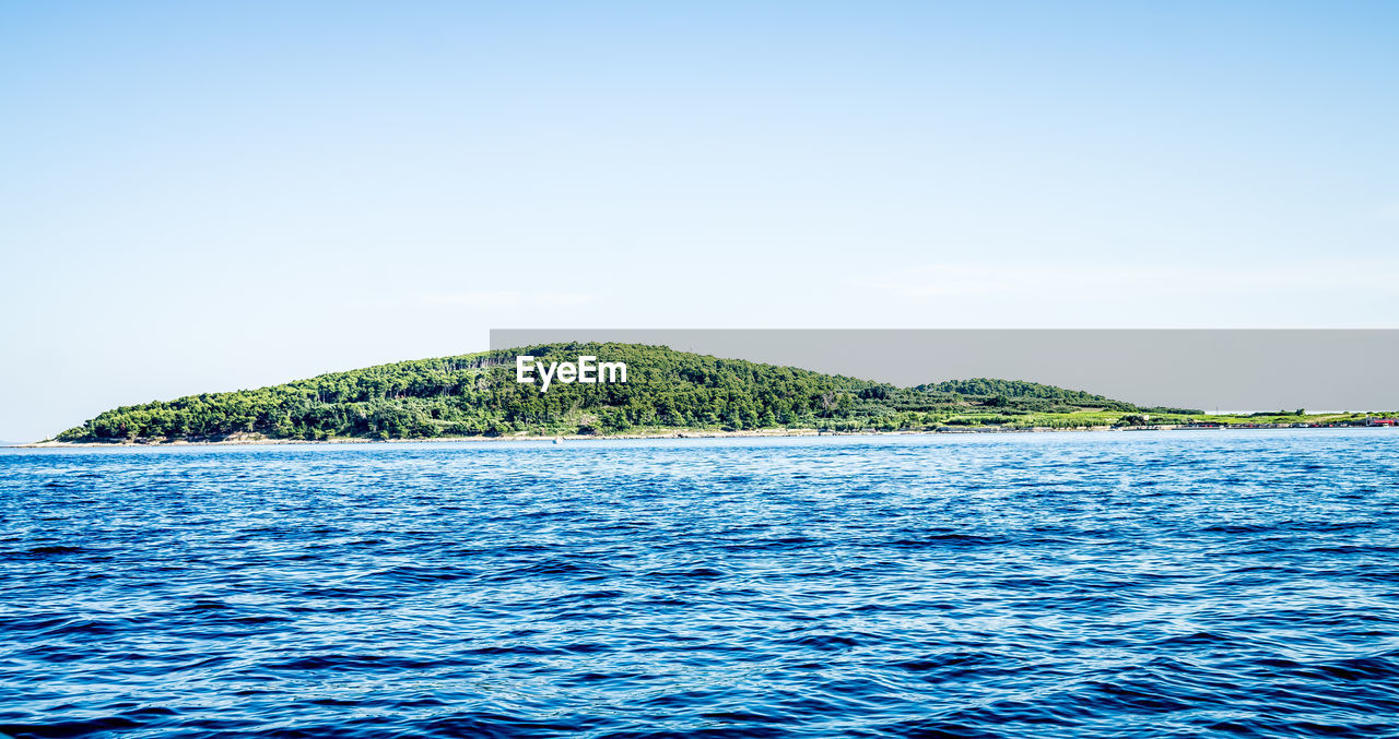 SCENIC VIEW OF SEA AGAINST BLUE SKY