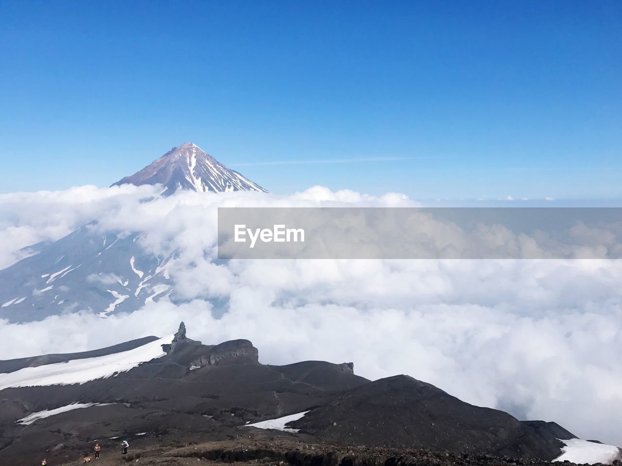 Low angle view of mountain against blue sky