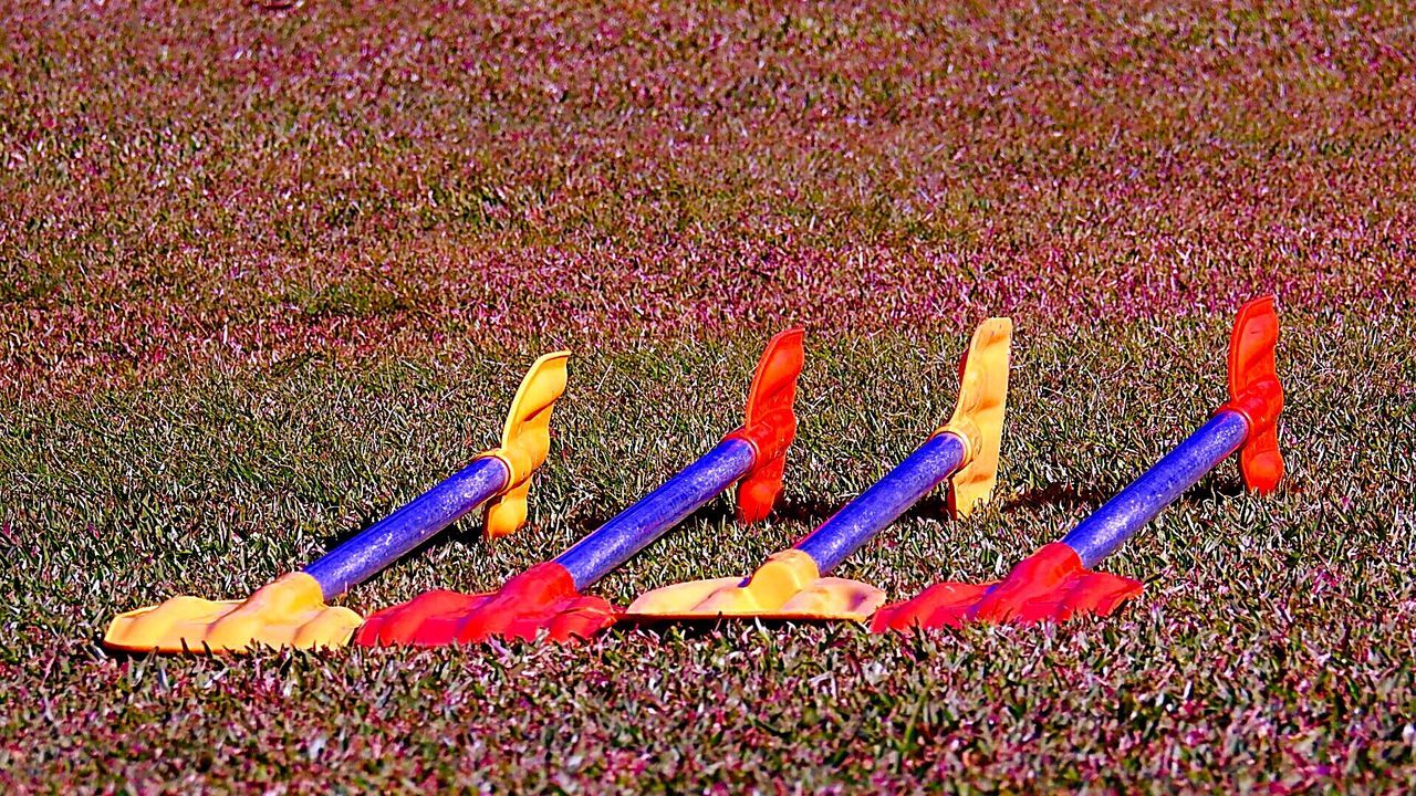 VIEW OF MULTI COLORED OBJECTS ON GROUND