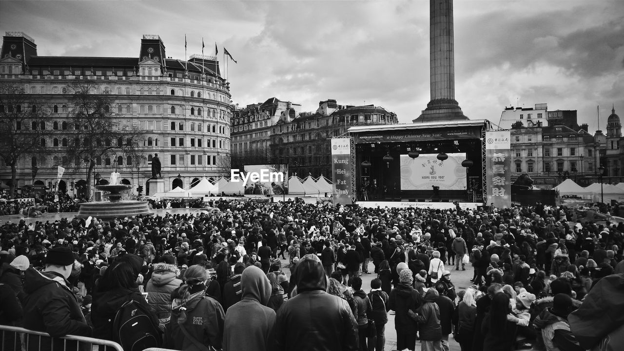 Crowd at town square in city