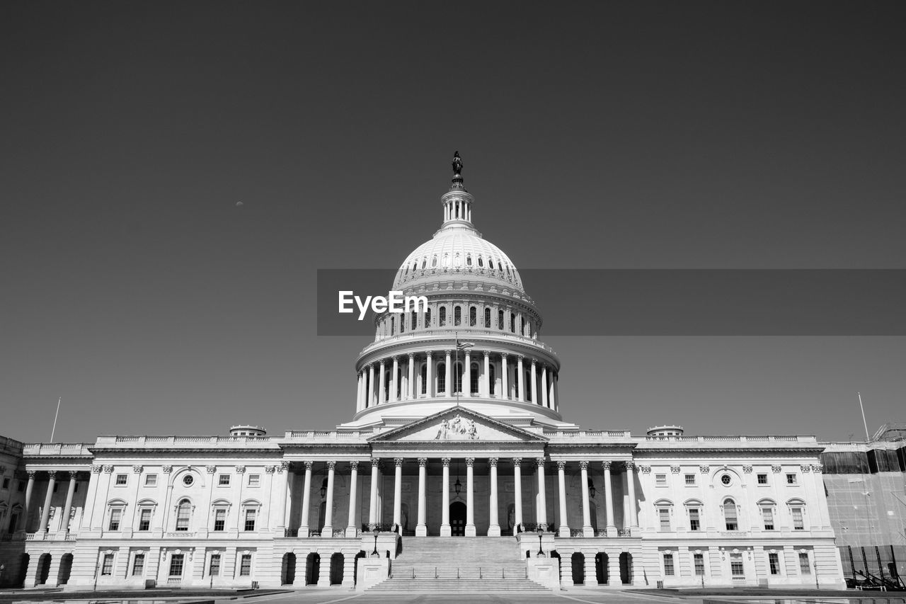 LOW ANGLE VIEW OF OFFICE BUILDING AGAINST SKY