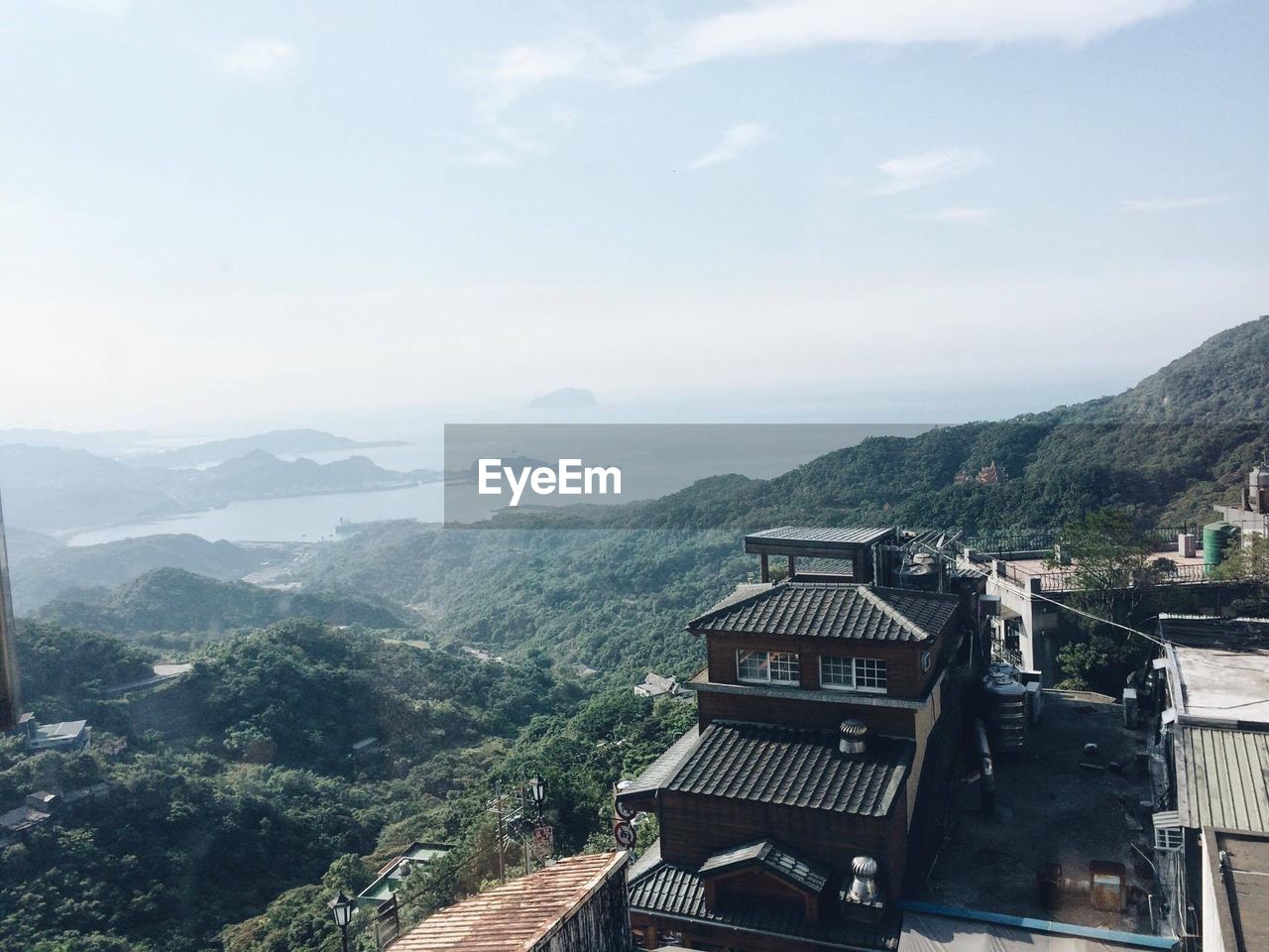 HIGH ANGLE VIEW OF TREES ON MOUNTAIN AGAINST SKY