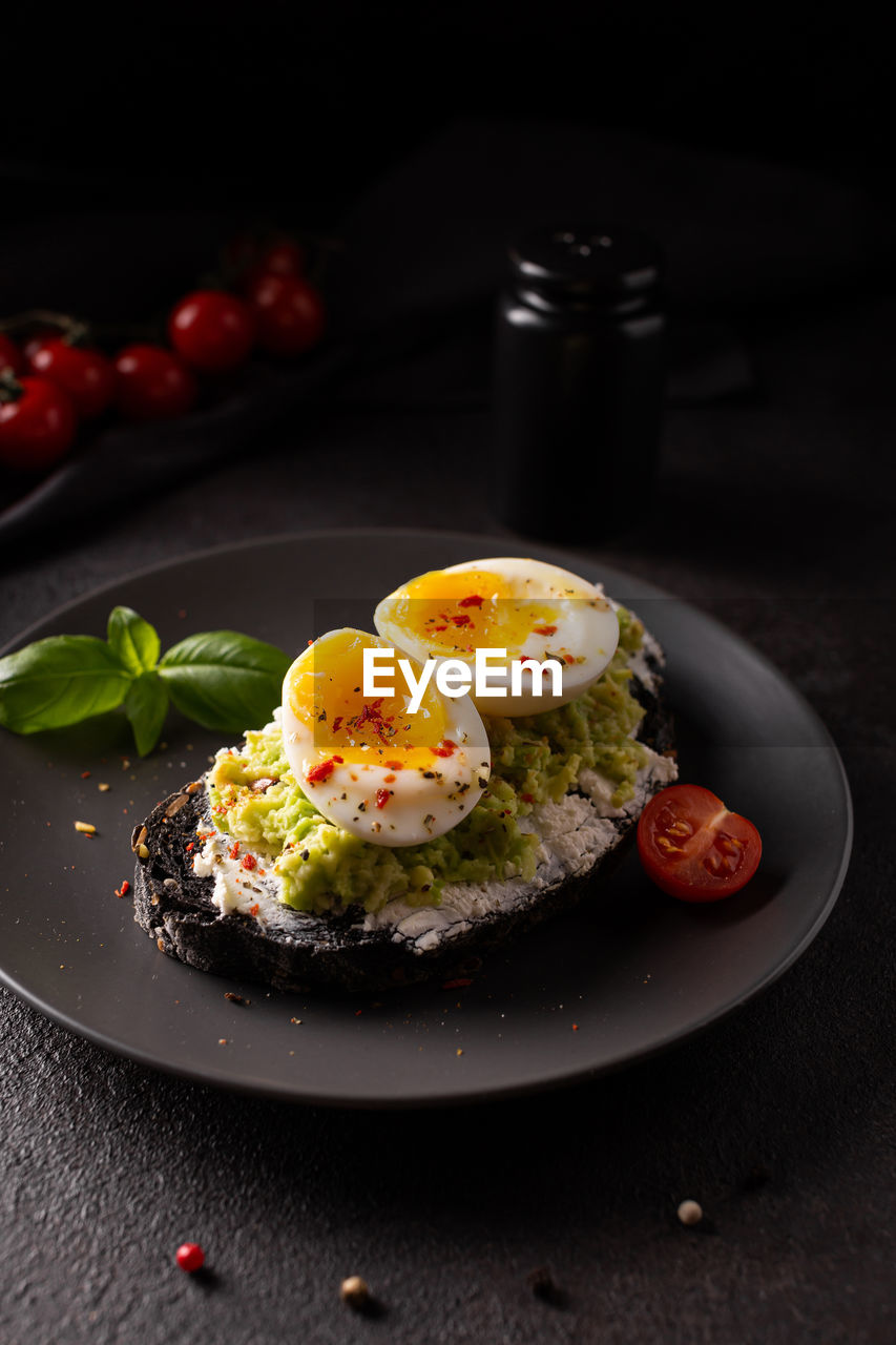 Breakfast with avocado toast with eggs on a plate