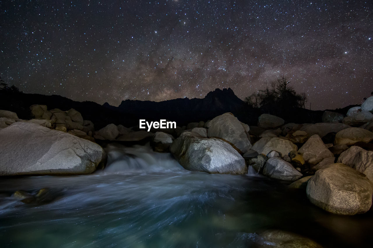 Scenic view of rocks at night