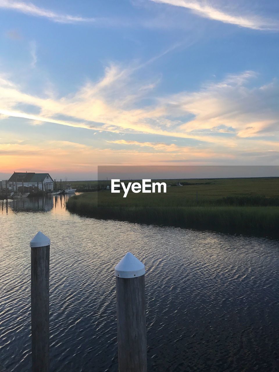 Scenic view of lake against sky during sunset