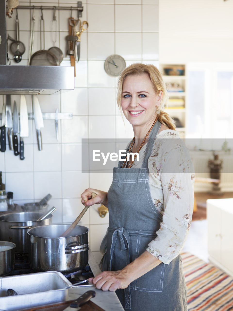 Smiling woman cooking