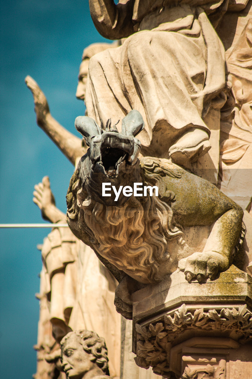 LOW ANGLE VIEW OF ANGEL SCULPTURE