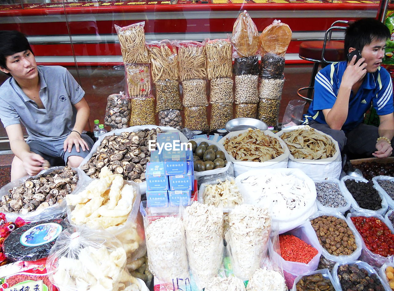 MIDSECTION OF MAN FOR SALE AT MARKET