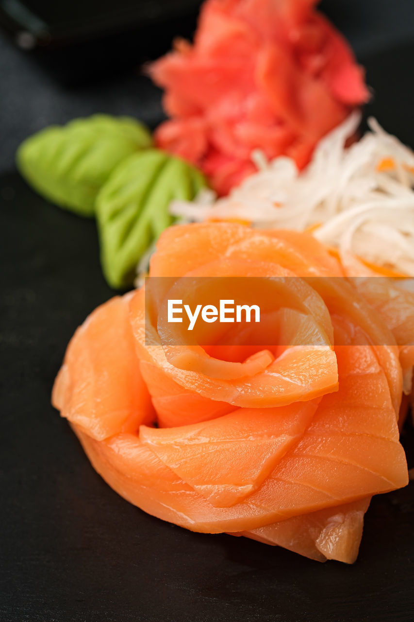 HIGH ANGLE VIEW OF ORANGE FISH ON TABLE AT HOME