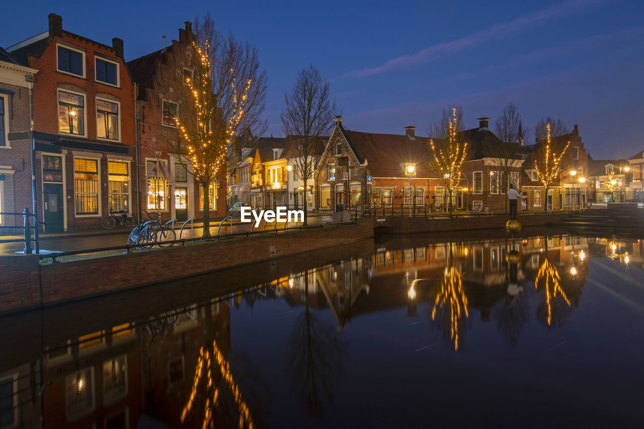 View on the city sneek with christmas in the netherlands at sunset