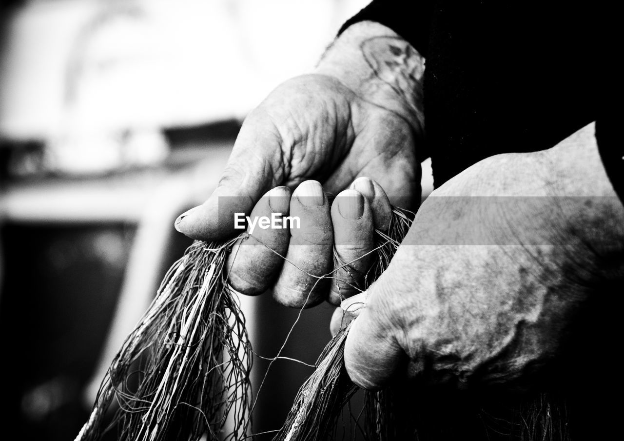 Midsection of person holding net