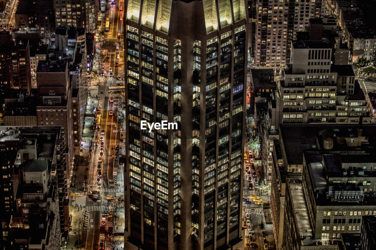 FULL FRAME SHOT OF ILLUMINATED BUILDINGS IN CITY