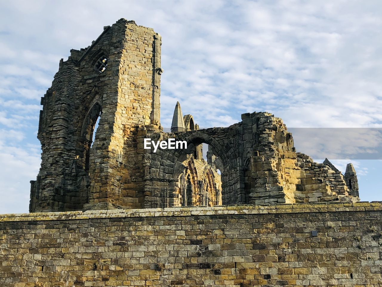 Low angle view of old temple building against sky