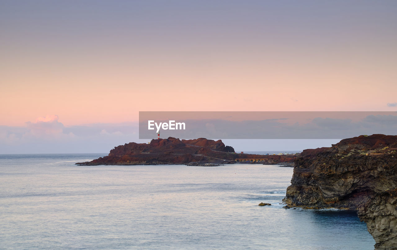 SCENIC VIEW OF SEA DURING SUNSET