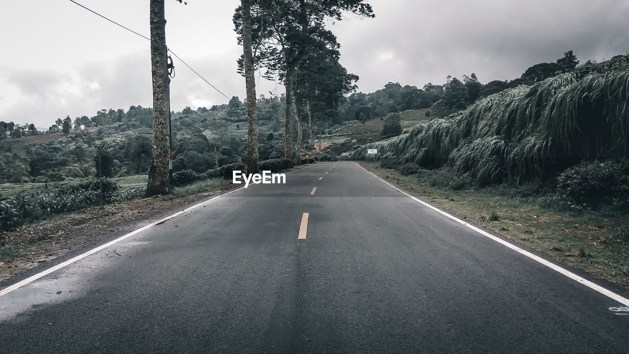 EMPTY ROAD AGAINST SKY