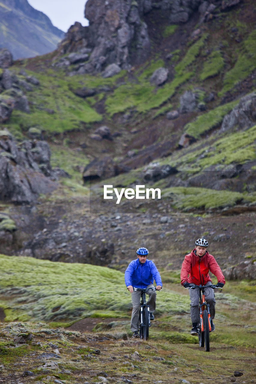 Two friends riding their mountain bikes around lake thingvellir