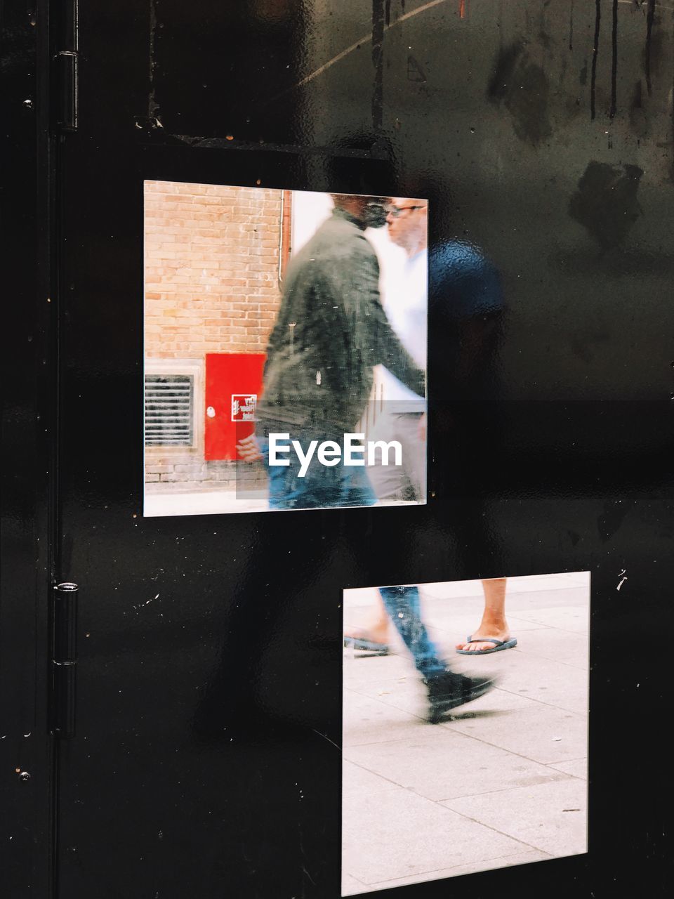 REFLECTION OF MAN ON WINDOW