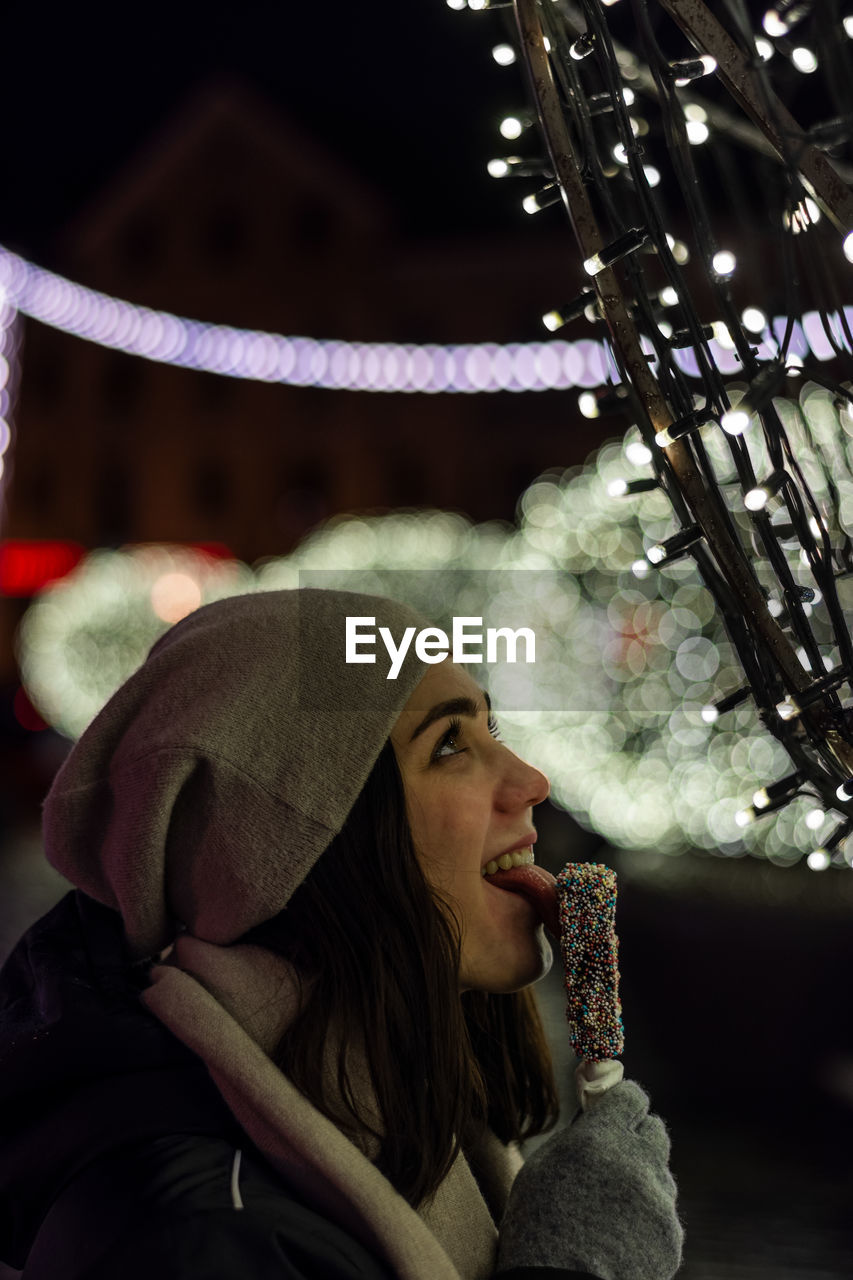 Young woman eating ice cream