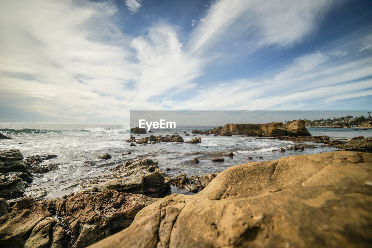 Scenic view of beach against sky