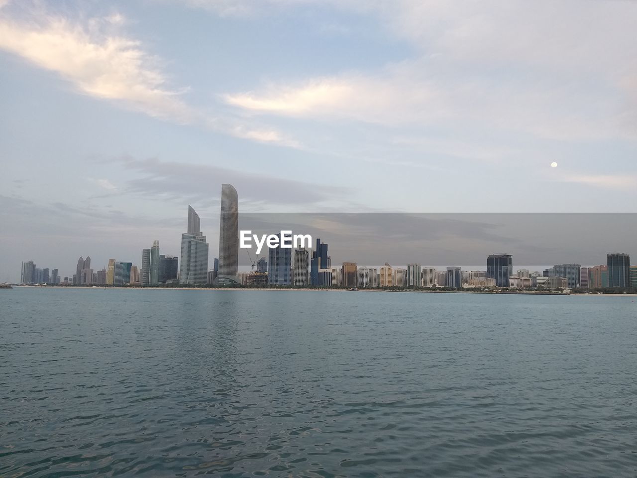 SEA AND BUILDINGS AGAINST SKY