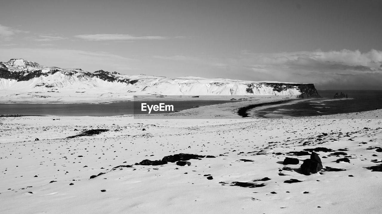 Scenic view of sea against sky during winter