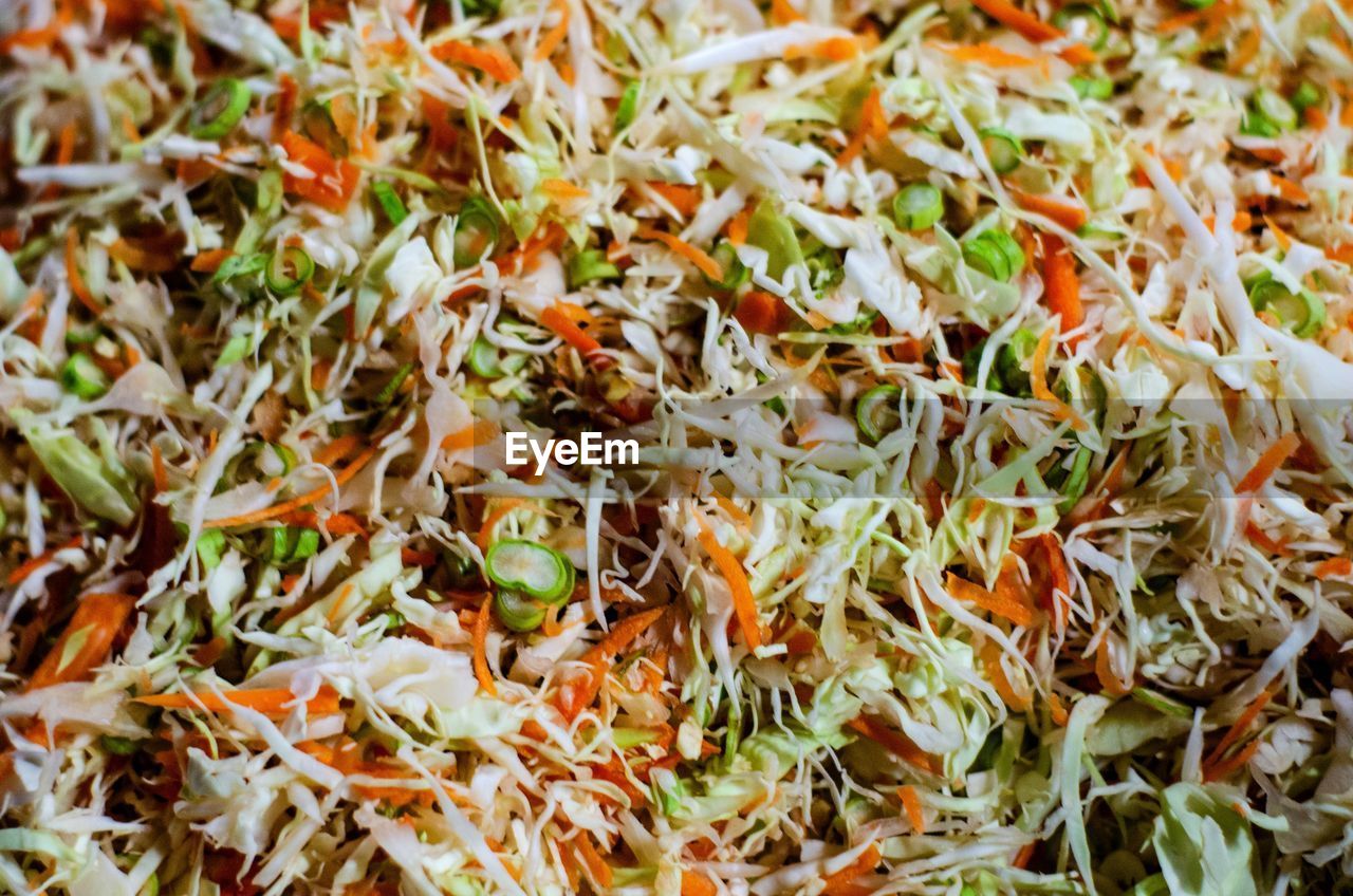 HIGH ANGLE VIEW OF CHOPPED VEGETABLES IN CONTAINER