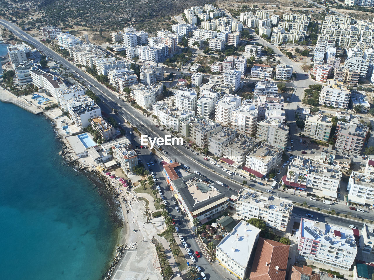 High angle view of swimming pool by buildings in city