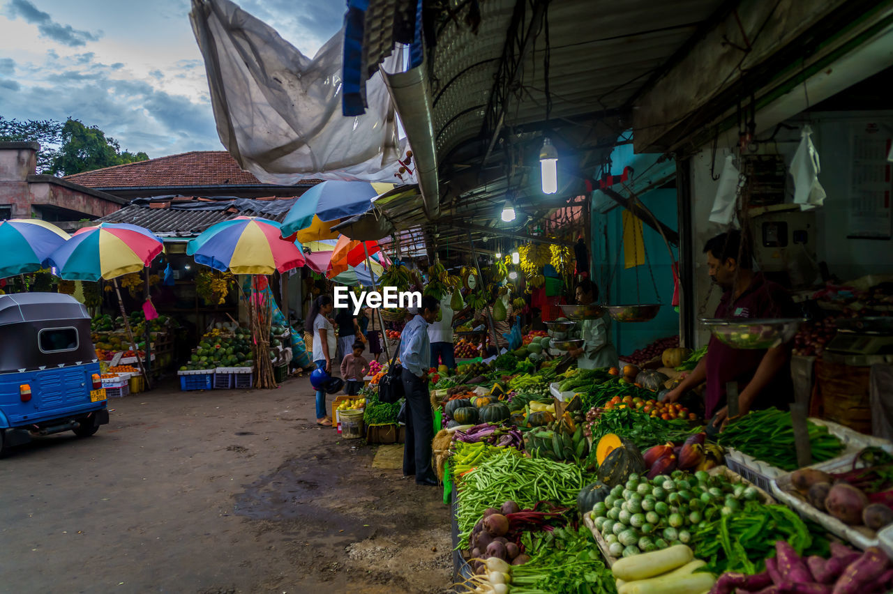 GROUP OF PEOPLE IN MARKET