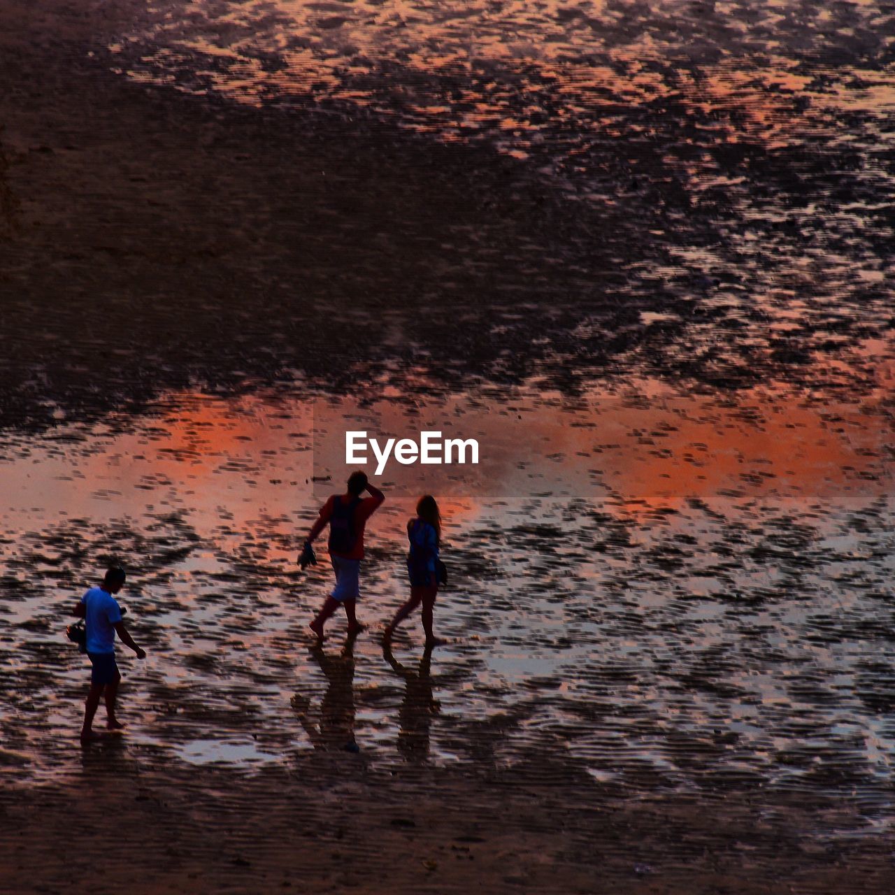 REFLECTION OF WOMAN IN WATER