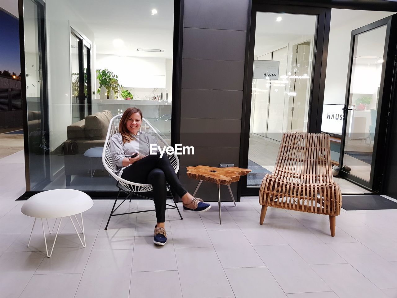 Rear view of woman sitting on chair