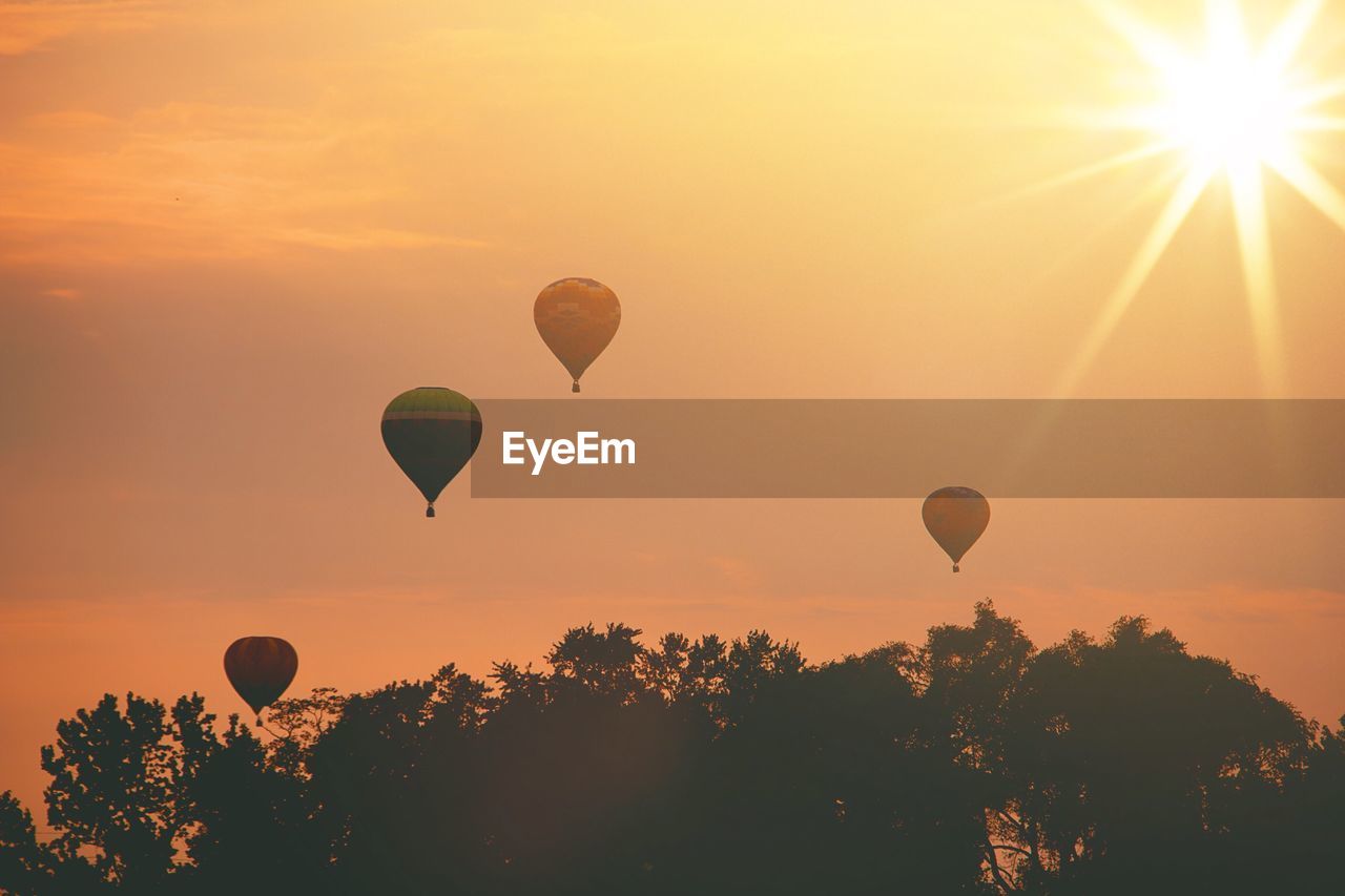 VIEW OF HOT AIR BALLOON AGAINST SKY DURING SUNSET