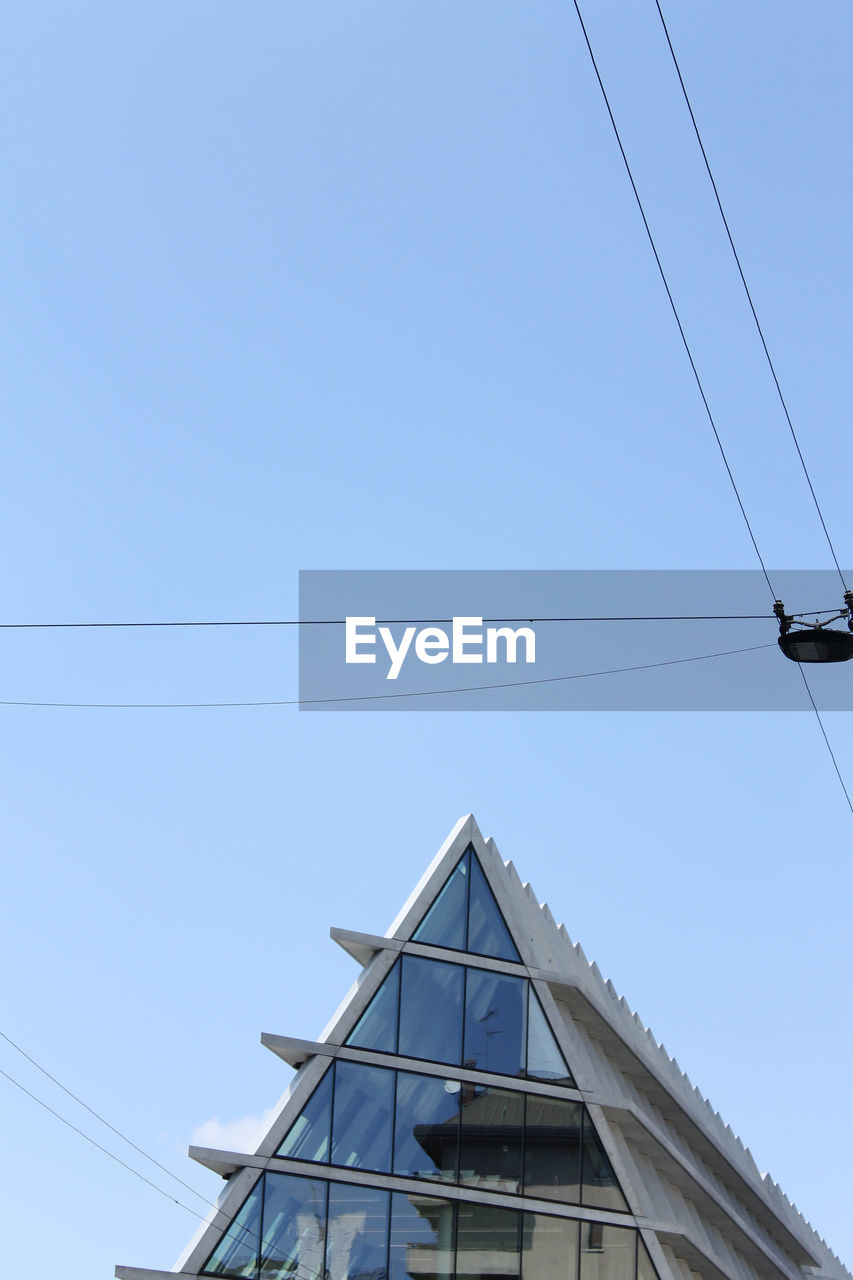 LOW ANGLE VIEW OF ELECTRICITY PYLON