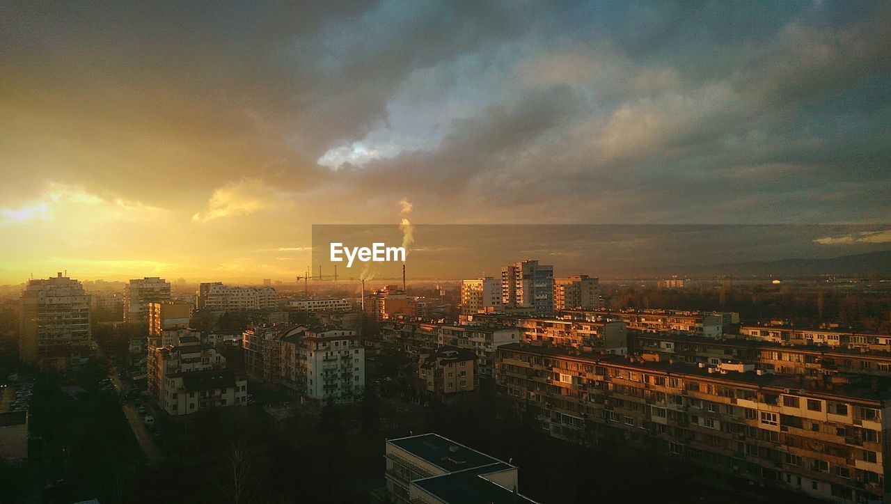 Panoramic view of cityscape against sky during sunset
