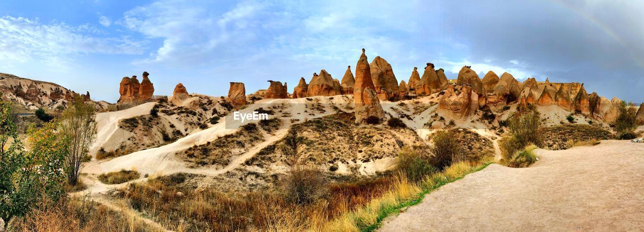 Panoramic view of rock formations against sky