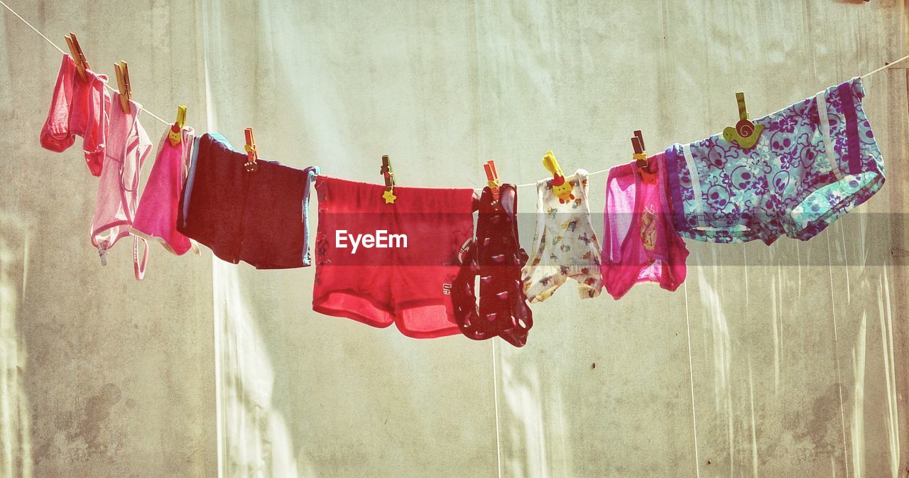 Undergarments hanging on clothesline outdoors