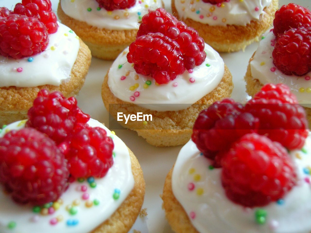 Close-up of raspberries on cupcakes