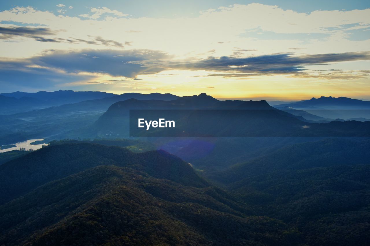 Scenic view of mountains against sky during sunset