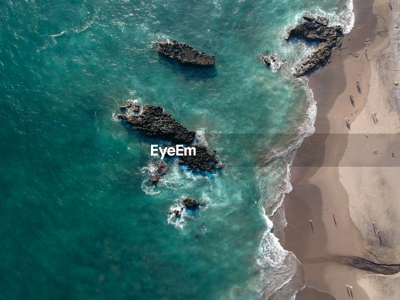 High angle view of rocks in sea