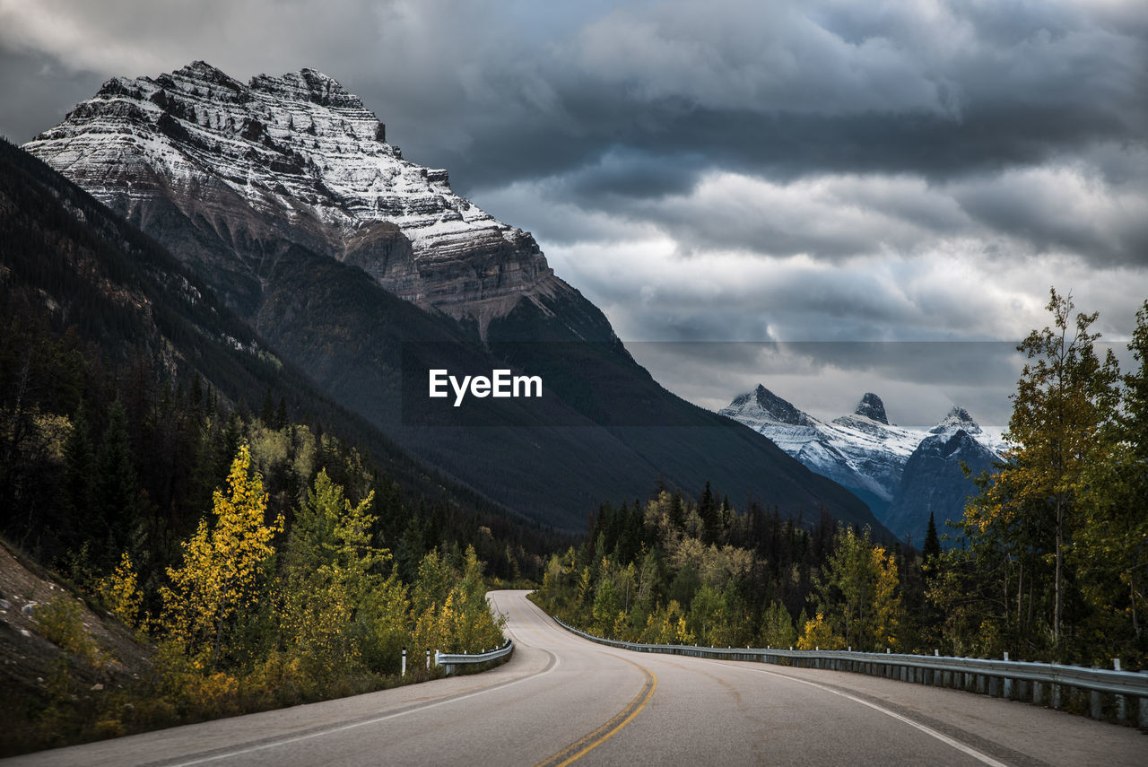 Driving the icefields parkway between jasper and banff with dramatic sky