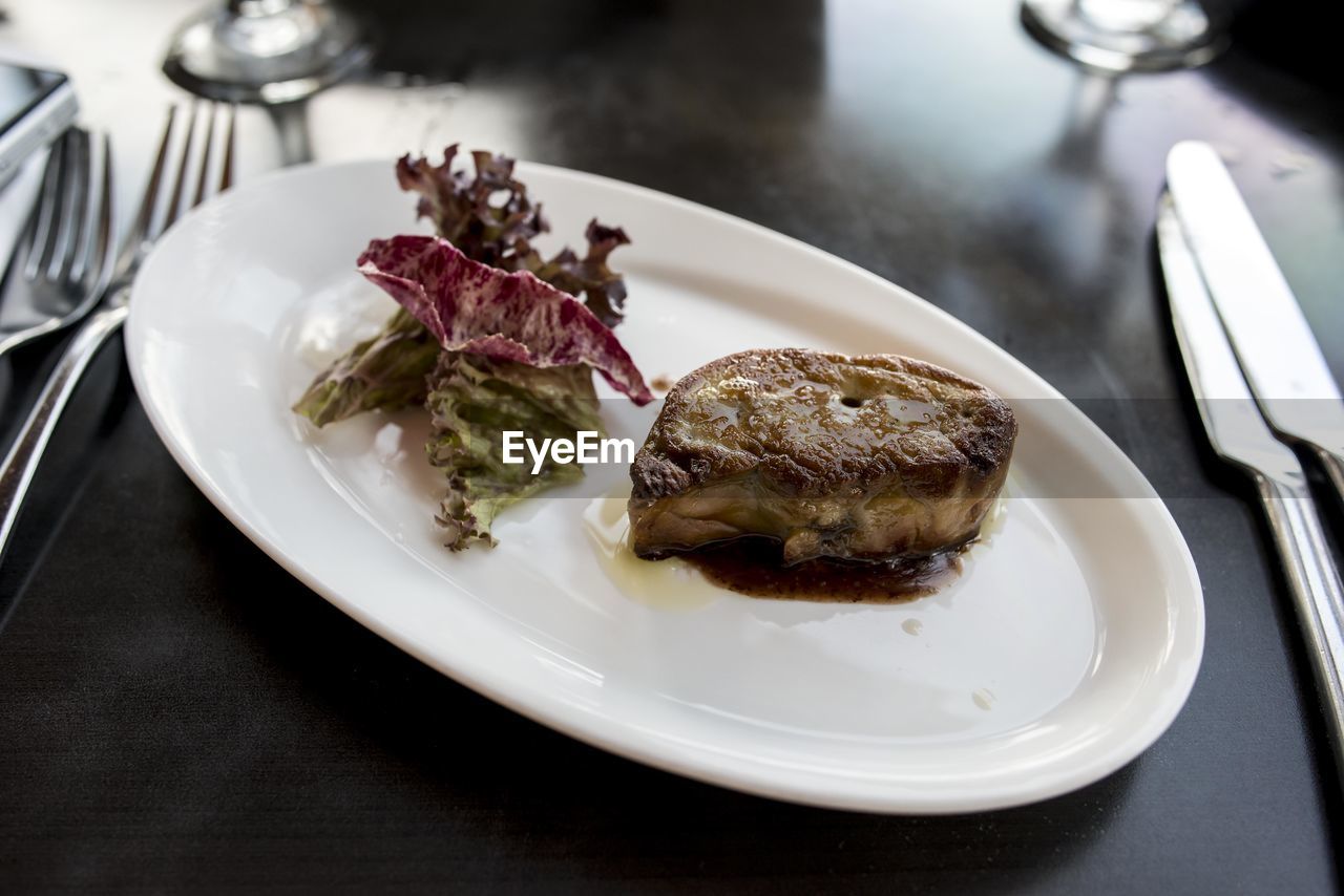 Close-up of foie gras in plate on table