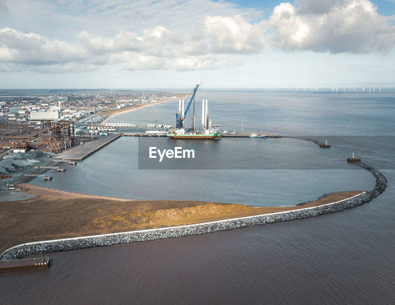 High angle view of harbor by sea against sky