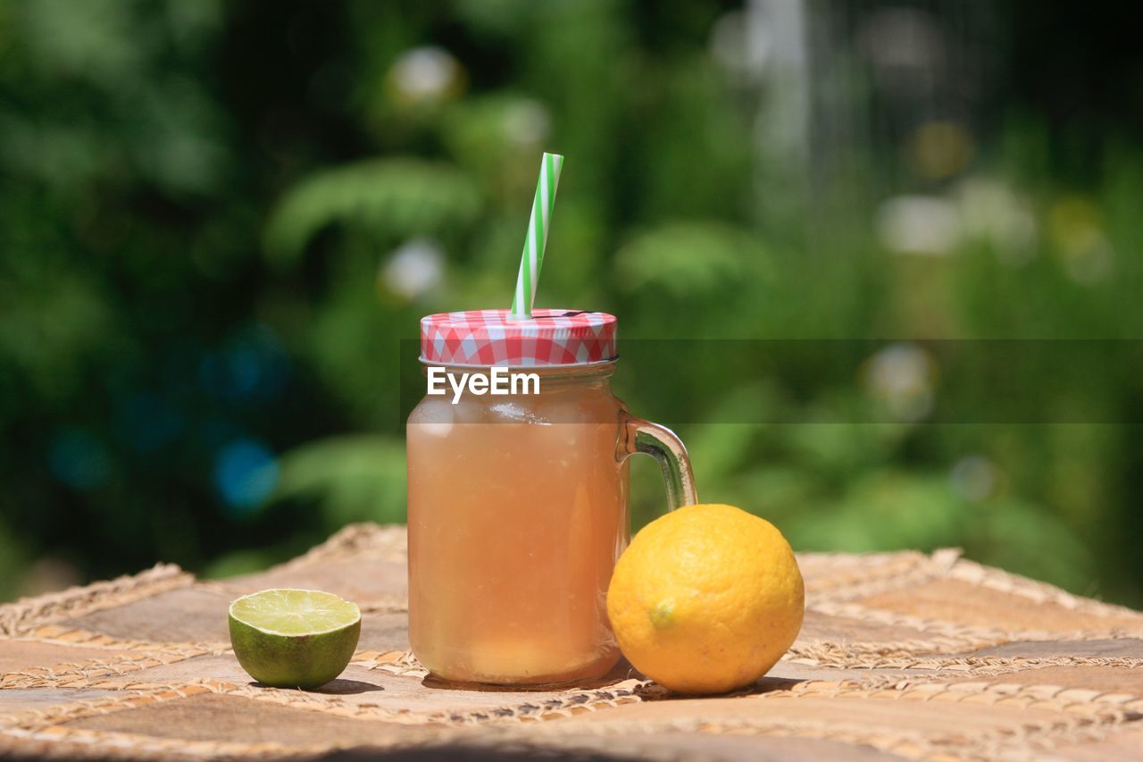 CLOSE-UP OF DRINK IN JAR