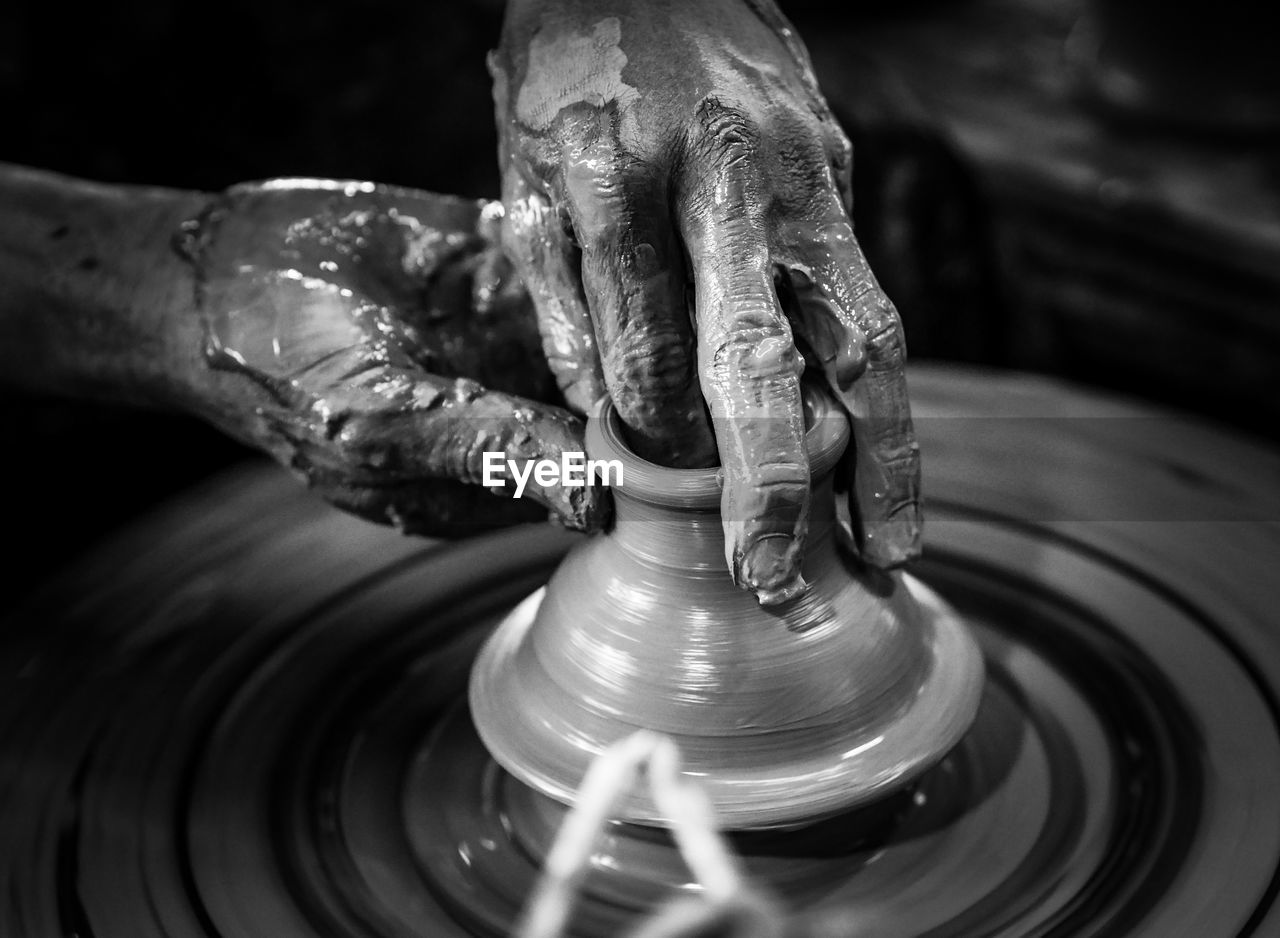 Man working on pottery wheel