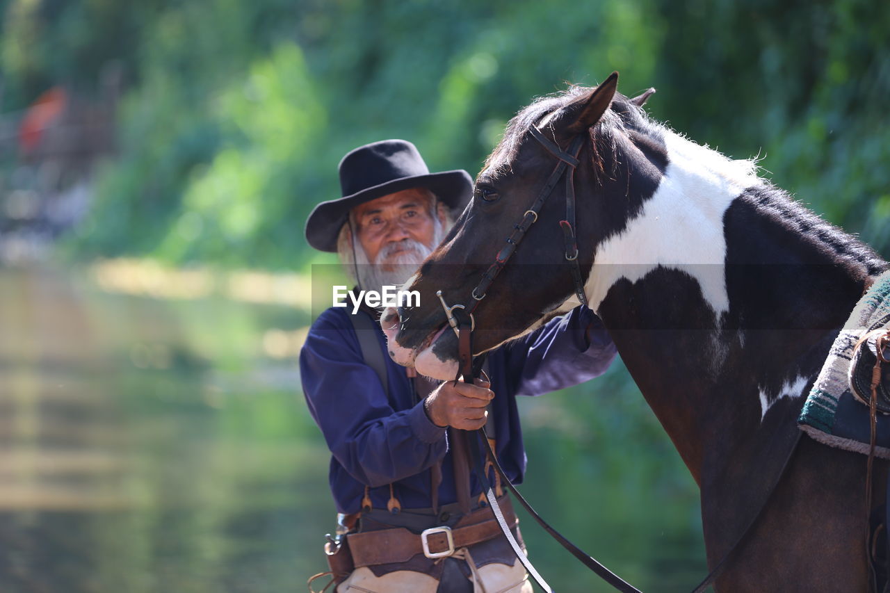 Portrait of man with horse