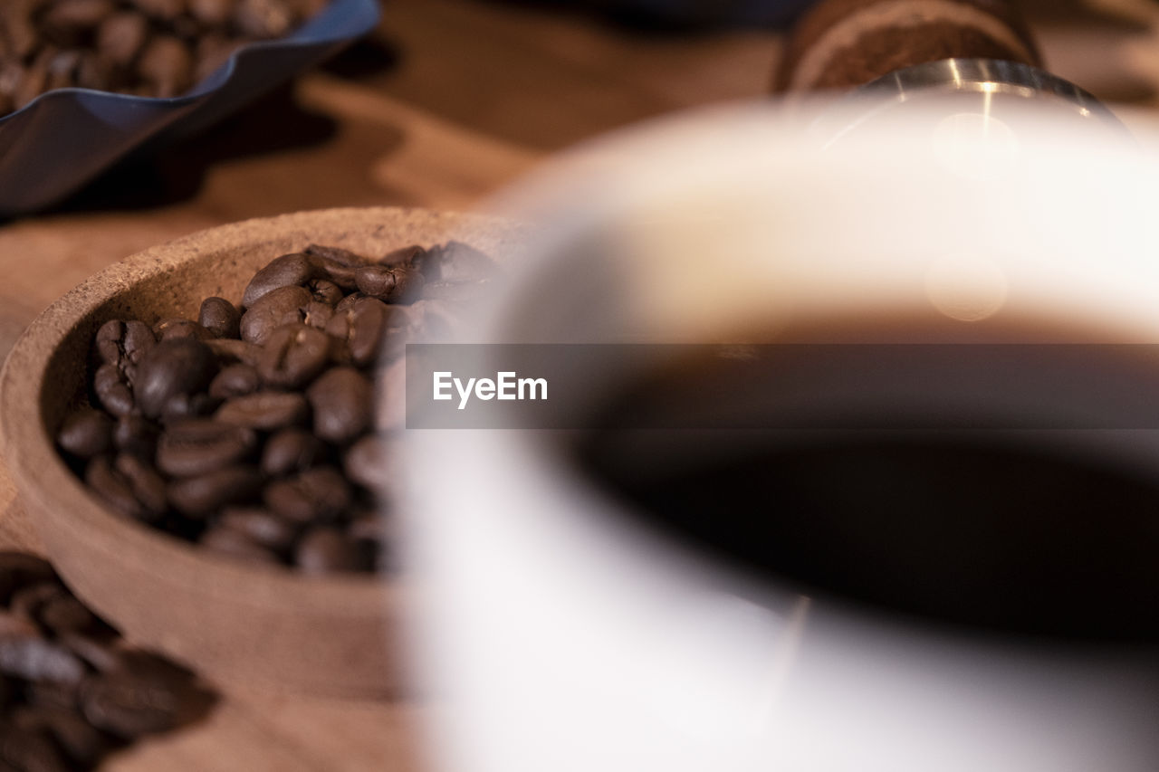 CLOSE-UP OF COFFEE BEANS IN GLASS