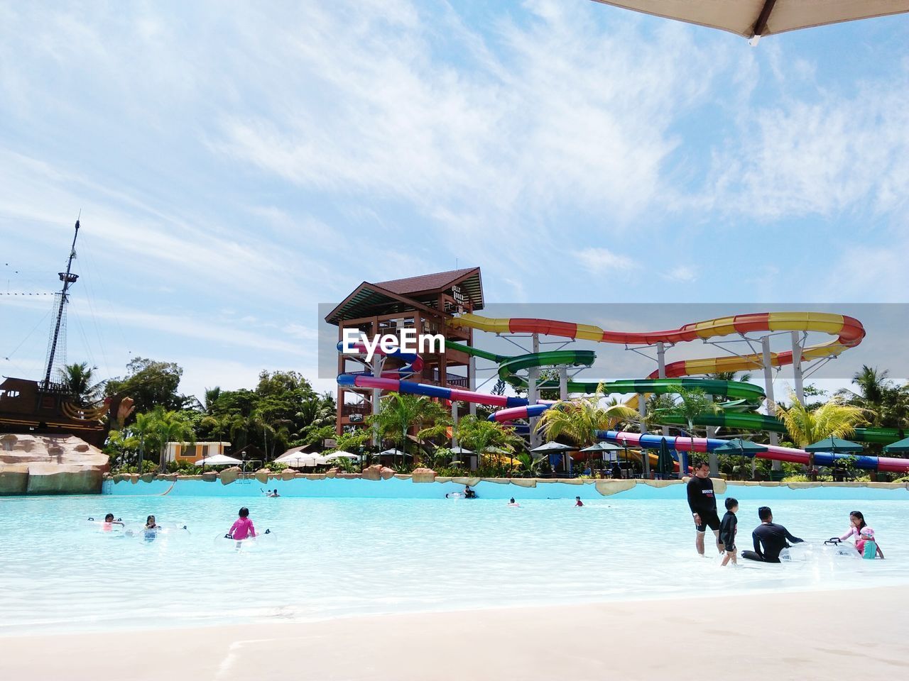 People at water park against sky