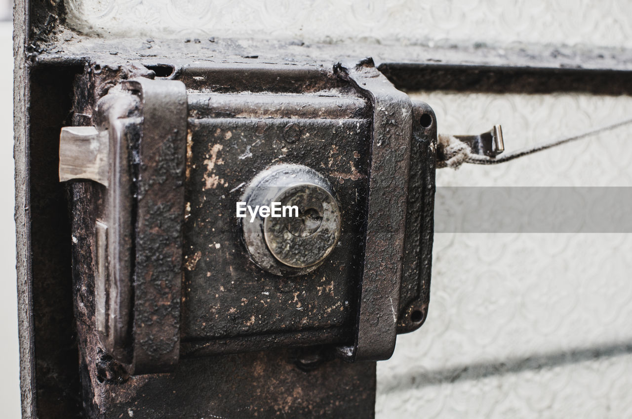 Close-up of old rusty metal door lock