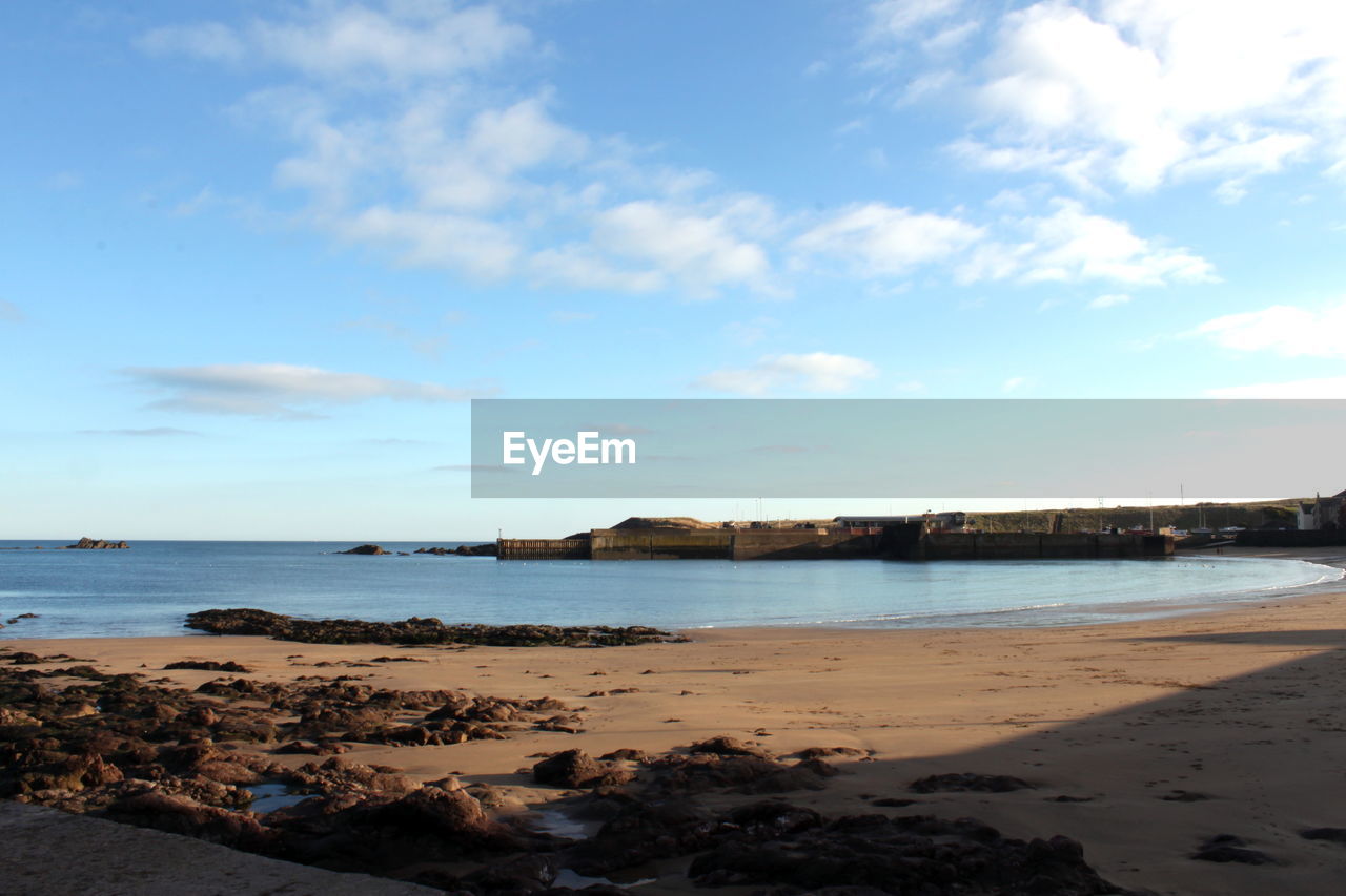 Scenic view of beach against sky