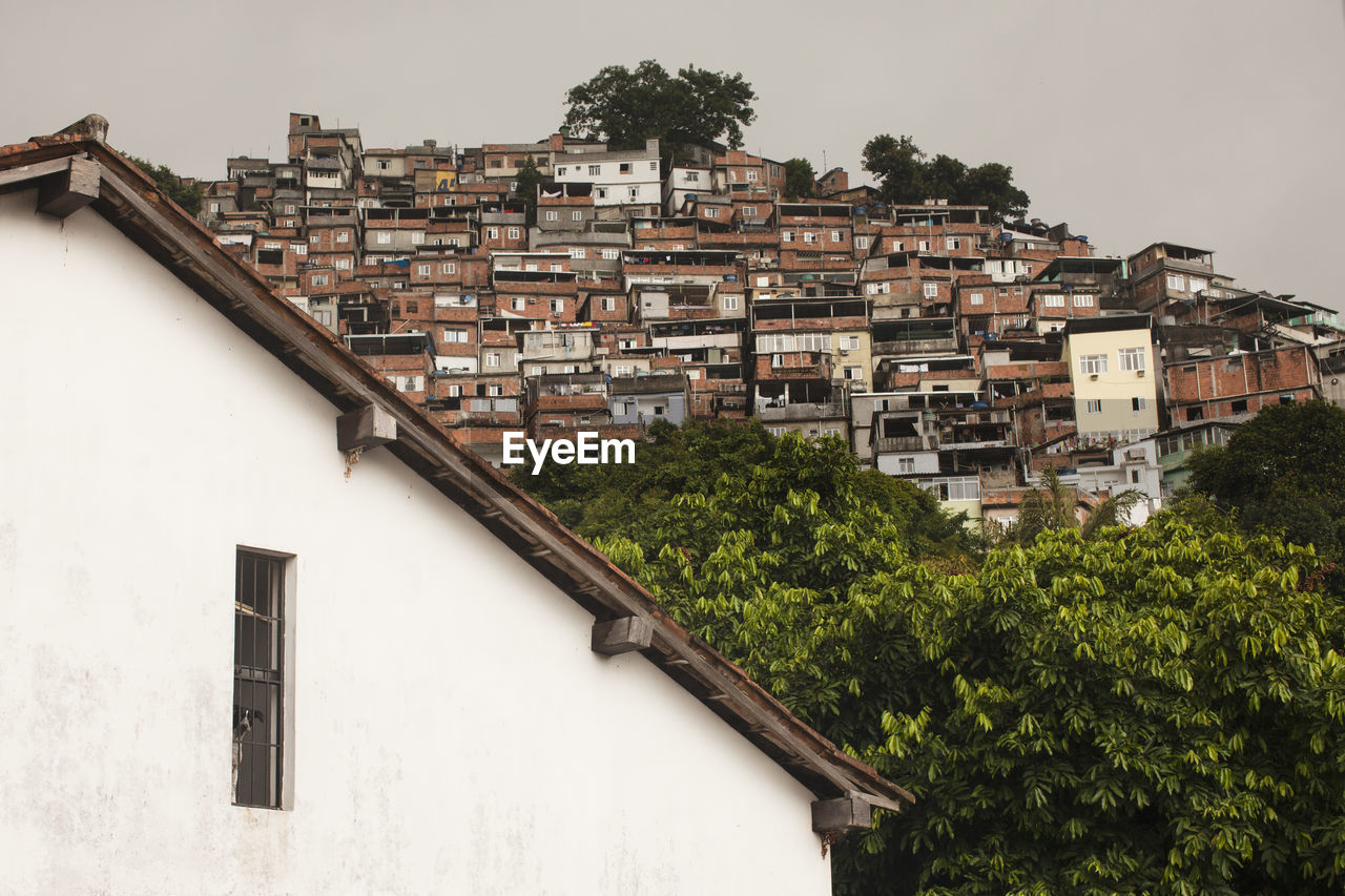 Favela buildings in town against clear sky rio de janeiro