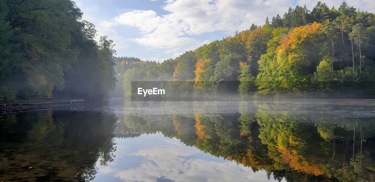 Scenic view of lake against sky during autumn